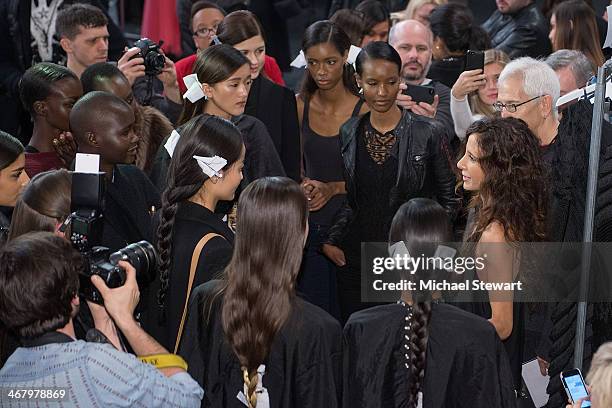 Designer Mara Hoffman prepares with models before the Mara Hoffman show during Mercedes-Benz Fashion Week Fall 2014 at The Salon at Lincoln Center on...