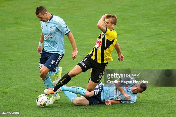 Joel Griffiths of the Phoenix is brought down in a tackle by Sebastian Ryall of Sydney FC during the round 23 A-League match between the Wellington...