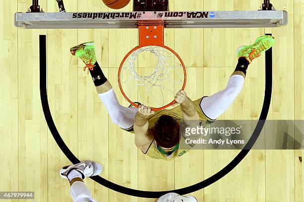 Pat Connaughton of the Notre Dame Fighting Irish dunks in the second half against the Kentucky Wildcats during the Midwest Regional Final of the 2015...
