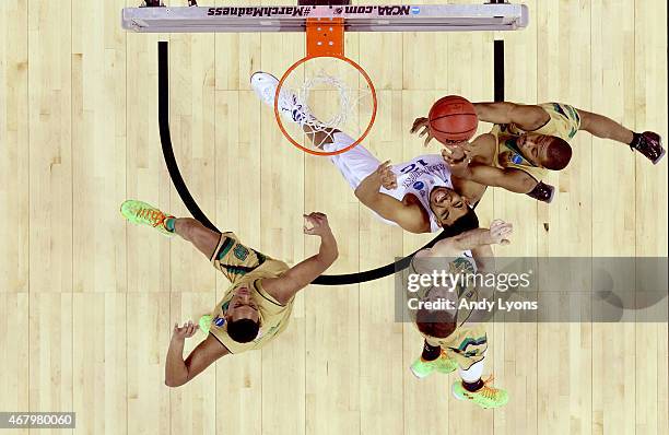 Karl-Anthony Towns of the Kentucky Wildcats goes up with the ball against the Notre Dame Fighting Irish during the Midwest Regional Final of the 2015...