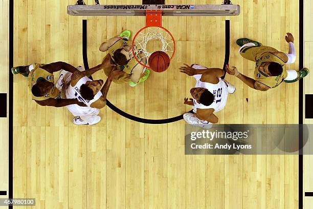 Willie Cauley-Stein and Karl-Anthony Towns of the Kentucky Wildcats wait for a rebound against Jerian Grant, Pat Connaughton and Zach Auguste of the...