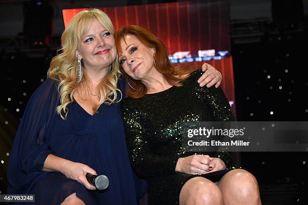 Actress Melissa Peterman and singer Reba McEntire onstage during Muhammad Ali's Celebrity Fight Night XXI at the Jw Marriott Phoenix Desert Ridge...