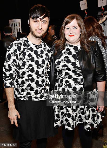 Brad Walsh and Aidy Bryant pose backstage at the Christian Siriano fashion show during the Mercedes-Benz Fashion Week Fall 2014 at Eyebeam on...