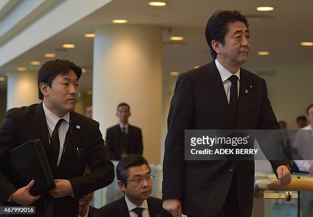 Japanese Prime Minister Shinzo Abe arrives at the University Cultural Center for the funeral of Singapore's former prime minister Lee Kuan Yew in...