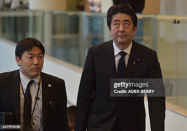 Japanese Prime Minister Shinzo Abe arrives at the University Cultural Center for the funeral of Singapore's former prime minister Lee Kuan Yew in...