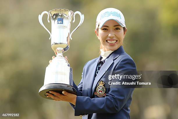 Ritsuko Ryu of Japan poses with the trophy after winning the AXA Ladies Golf Tournament at the UMK Country Club on March 29, 2015 in Miyazaki, Japan.