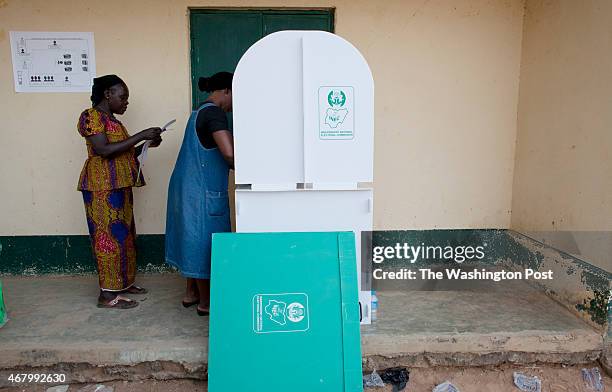 Kaduna Nigeria: A woman casts her vote at a polling station in Kaduna, Nigeria on Saturday, March 28, 2015.