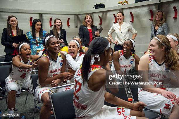 Teammates congratulate Maryland Terrapins guard Kiara Leslie as Maryland Terrapins head coach Brenda Frese gives a shout out to her game in the...