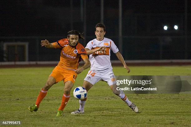 Luis de Souza of Delfines fights for the ball with Norelli Eder of Correcaminos during a match between Delfines and Correcaminos as part of the...