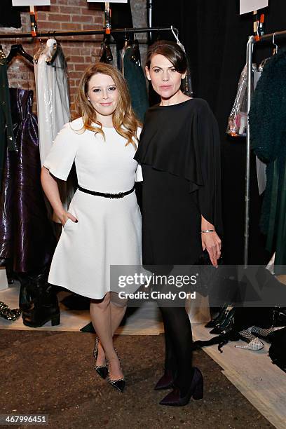 Actresses Natasha Lyonne and Clea DuVall pose backstage at the Christian Siriano fashion show during the Mercedes-Benz Fashion Week Fall 2014 at...