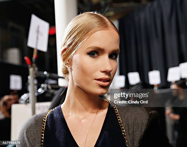 Model prepares backstage at the Christian Siriano fashion show during the Mercedes-Benz Fashion Week Fall 2014 at Eyebeam on February 8, 2014 in New...