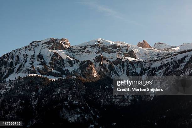 bold alp mountain range in sunshine - lungern stock-fotos und bilder
