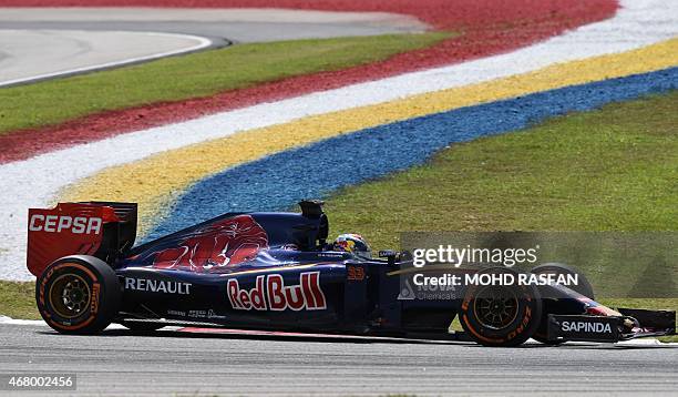 Scuderia Toro Rosso's Belgian-Dutch driver Max Verstappen races through a corner during the Formula One Malaysian Grand Prix in Sepang on March 29,...