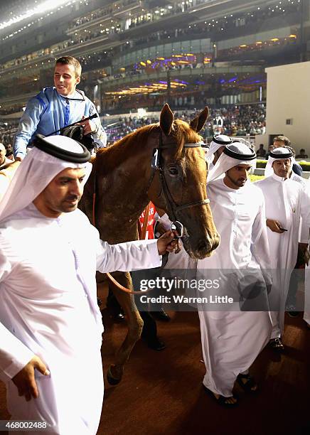 Hamdan bin Mohammed bin Rashid Al Maktoum, Crown Prince of Dubai and Godolphin trainer Saeed bin Suroor lead Prince Bishop into the winner enclosure...