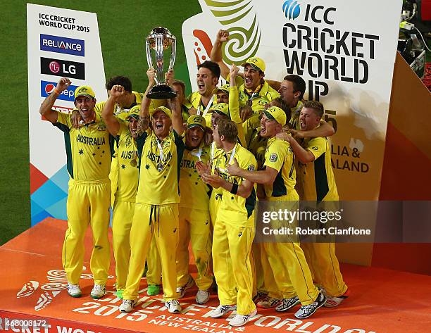 Australia celebrate after they defeated New Zealand during the 2015 ICC Cricket World Cup final match between Australia and New Zealand at Melbourne...