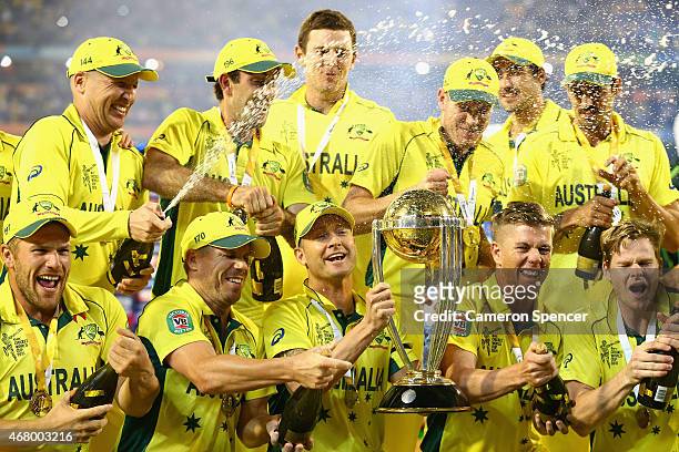 Australian players celebrate winning the 2015 ICC Cricket World Cup final match between Australia and New Zealand at Melbourne Cricket Ground on...