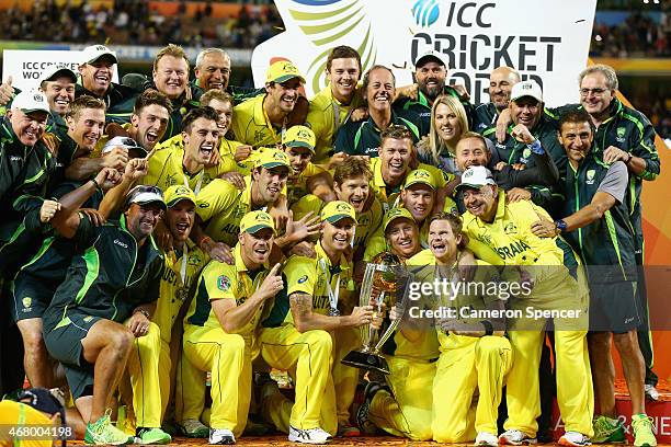 Australian captain Michael Clarke, Australian players and support staff celebrate winning the 2015 ICC Cricket World Cup final match between...