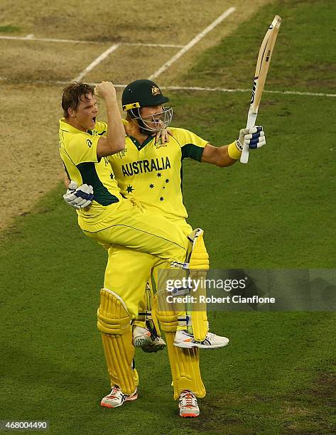 Steve Smith and Shane Watson of Australia celebrate after Australia defeated New Zealand during the 2015 ICC Cricket World Cup final match between...