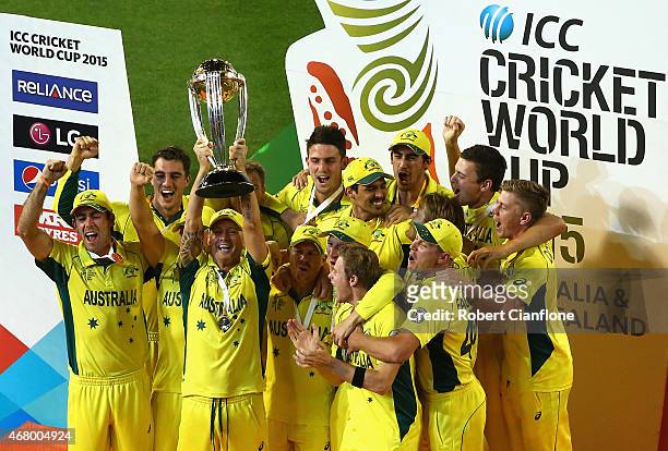 Australia celebrate after they defeated New Zealand during the 2015 ICC Cricket World Cup final match between Australia and New Zealand at Melbourne...