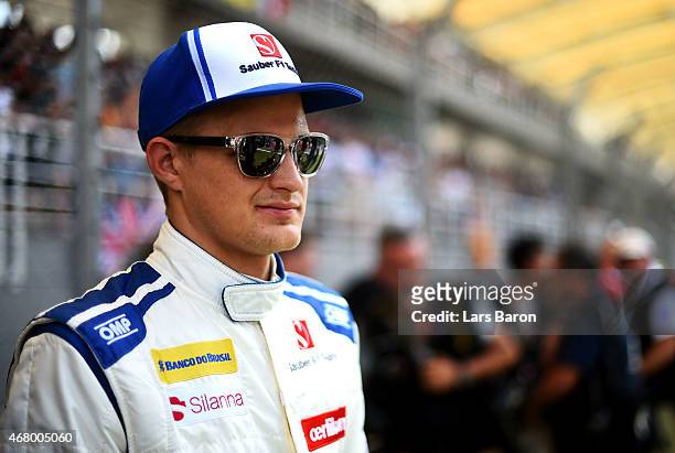 Marcus Ericsson of Sweden and Sauber F1 prepares on the grid before the Malaysia Formula One Grand Prix at Sepang Circuit on March 29, 2015 in Kuala...