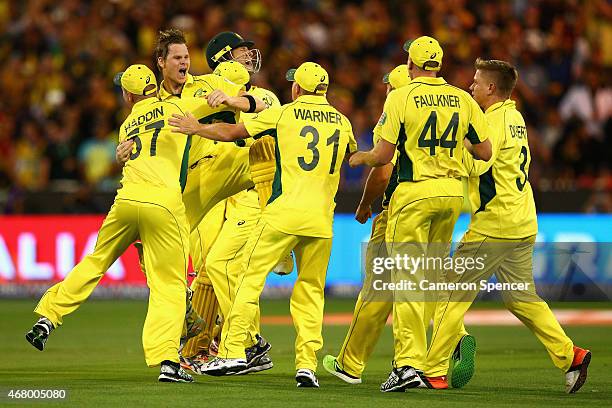 Steve Smith of Australia and team mates celebrate winning the 2015 ICC Cricket World Cup final match between Australia and New Zealand at Melbourne...