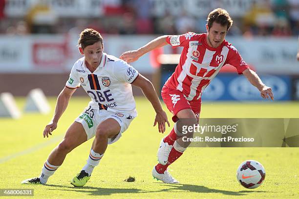Riley Woodcock of the Glory and Mate Dugandzic of the Heart contest the ball during the round 18 A-League match between Melbourne Heart and Perth...