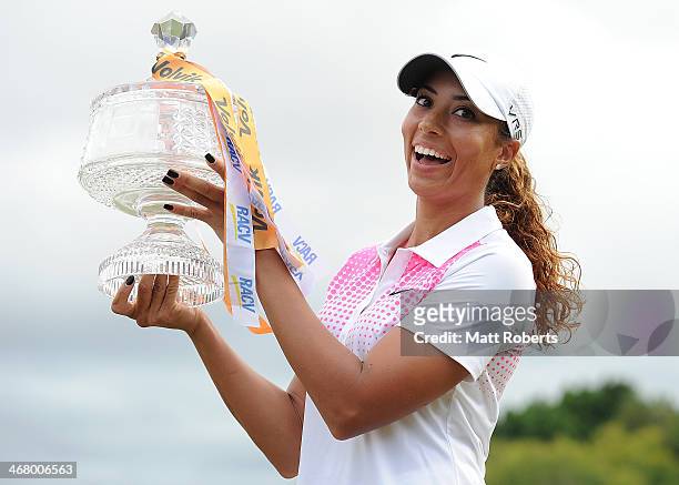 Cheyenne Woods of the United States holds the winners trophy after day four of the 2014 Ladies Masters at Royal Pines Resort on February 9, 2014 on...