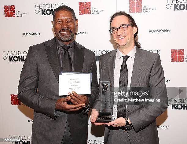 Presenter Dennis Haysbert and Production Designer Todd Cherniawsky receives the award for Excellence in Production Design for a Commercial or Music...