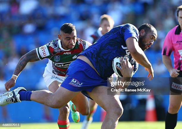 Sam Kasiano scores a try for the Bulldogs as Nathan Merritt attempts to defend during the NRL trial match between the Canterbury Bulldogs and the...