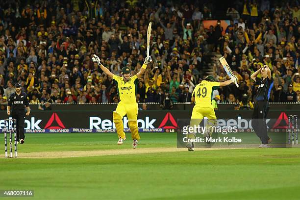 Shane Watson and Steve Smith of Australia celebrate victory during the 2015 ICC Cricket World Cup final match between Australia and New Zealand at...
