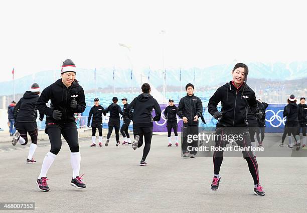 Members of the Japan women's hockey team warm up outside the stadium prior to the Women's Ice Hockey Preliminary Round Group B Game between Sweden...