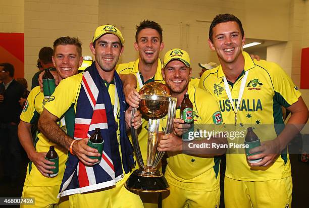 Xavier Doherty, Glenn Maxwell, Mitch Marsh, Aaron Finch and Josh Hazlewood of Australia pose with the trophy in the chnage rooms after the 2015 ICC...