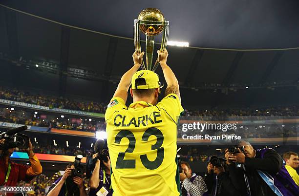 Michael Clarke of Australia celebrates with the trophy during the 2015 ICC Cricket World Cup final match between Australia and New Zealand at...