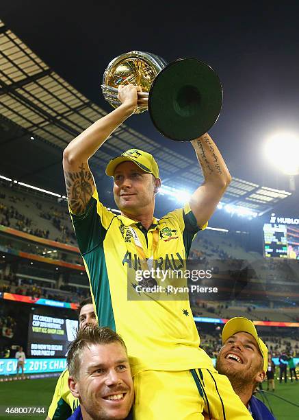 Michael Clarke of Australia celebrates with the trophy during the 2015 ICC Cricket World Cup final match between Australia and New Zealand at...