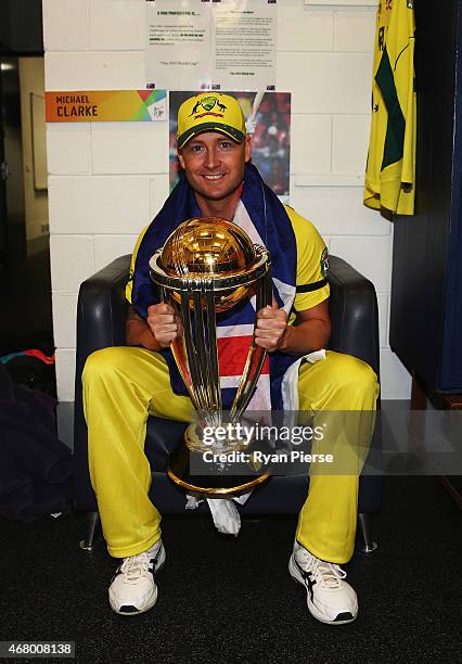 Michael Clarke of Australia poses with the trophy in the change rooms after the 2015 ICC Cricket World Cup final match between Australia and New...