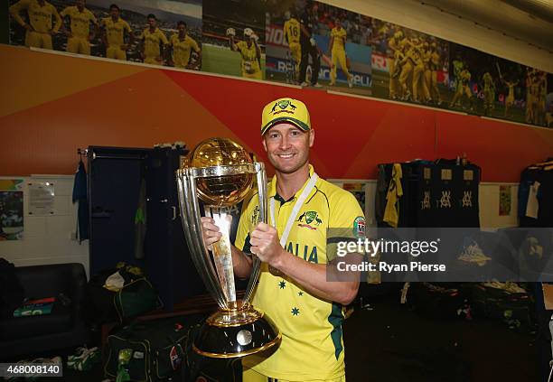 Michael Clarke of Australia poses with the trophy in the change rooms after the 2015 ICC Cricket World Cup final match between Australia and New...