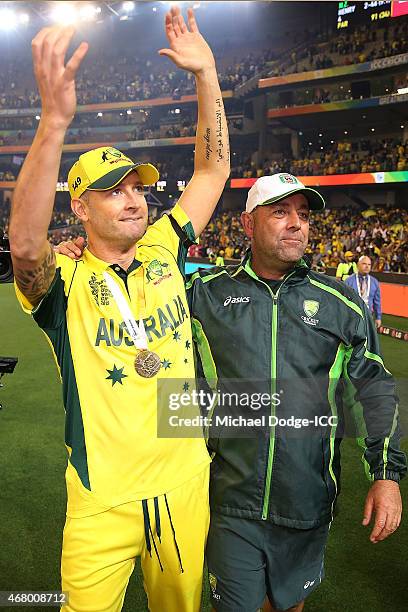 Australian captain Michael Clarke and coach Darren Lehmann celebrate after winning during the 2015 ICC Cricket World Cup final match between...