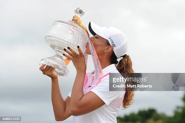 Cheyenne Woods of the United States kisses the winners trophy after day four of the 2014 Ladies Masters at Royal Pines Resort on February 9, 2014 on...