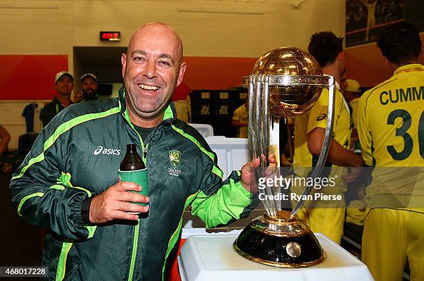 Darren Lehmann, coach of Australia, celebrates with the trophy during the 2015 ICC Cricket World Cup final match between Australia and New Zealand at...