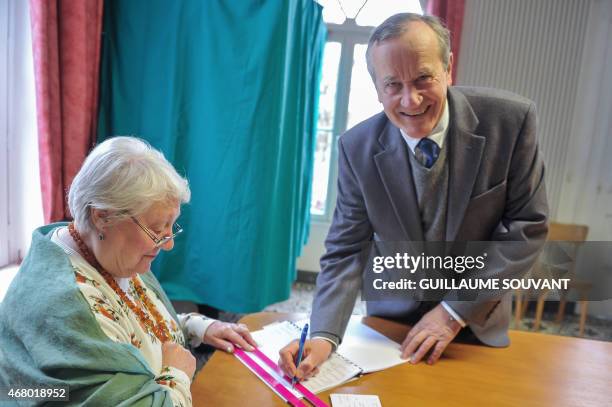 Pierre Louault, Centrist Party, Mayor of Chedigny and leader of the opposition to the General Council signs the register after casting his ballot...