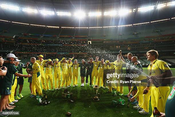 The Australian Team celebrate on the ground at 2.15am after the 2015 ICC Cricket World Cup final match between Australia and New Zealand at Melbourne...