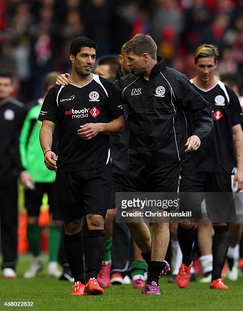 Luis Suarez and Steven Gerrard of the Gerrard XI chat at full time following the Liverpool All-Star Charity match at Anfield on March 29, 2015 in...