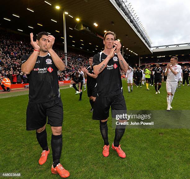 Luis Suarez and Fernando Torres walk around the pitch at the end of the Liverpool All Star Charity Match at Anfield on March 29, 2015 in Liverpool,...