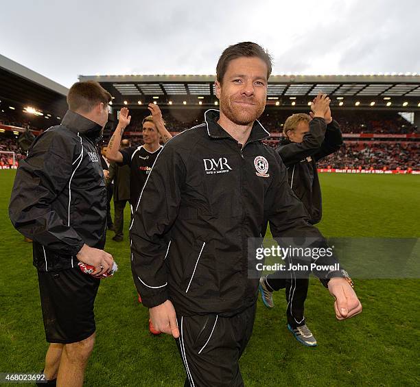 Xabi Alonso walks around the pitch at the end of the Liverpool All Star Charity Match at Anfield on March 29, 2015 in Liverpool, England.