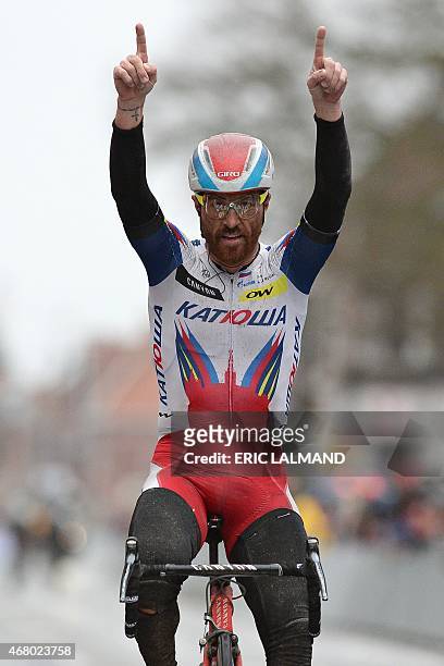 Italian Luca Paolini of Team Katusha celebrates as he crosses and win the 77th edition of the Gent-Wevelgem one day cycling race on March 29, 2015 in...