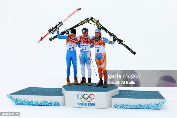 Silver medalist Christof Innerhofer of Italy, gold medalist Christof Innerhofer of Austria and bronze medalist Kjetil Jansrud of Norway stand on the...