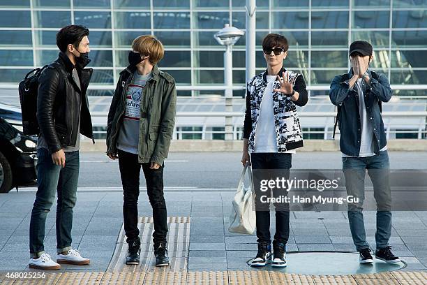 Choi Si-Won , Eunhyuk, Leeteuk and Donghae of South Korean boy band Super Junior are seen on departure at Incheon International Airport on March 28,...