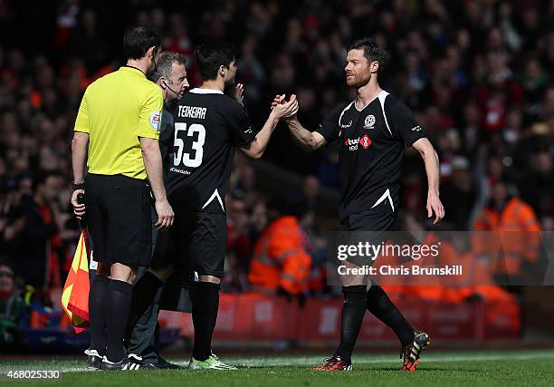 Xabi Alonso of the Gerrard XI is substituted during the Liverpool All-Star Charity match at Anfield on March 29, 2015 in Liverpool, England.