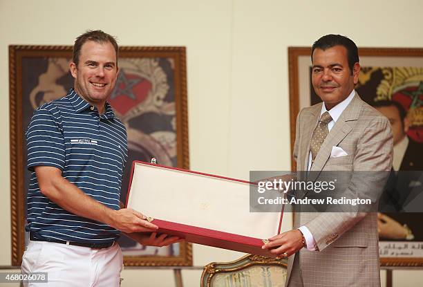 Richie Ramsay of Scotland is presented with his winner's trophy by HRH Prince Moulay Rachid of Morocco after the final round of the Trophee Hassan II...