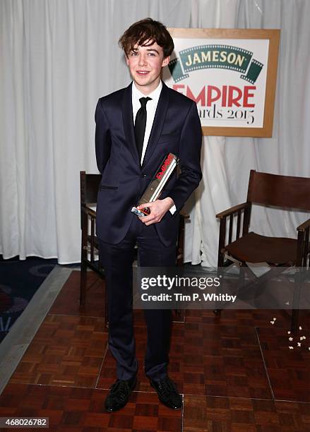 Alex Lawther collects the Best Thriller Award for The Imitation Game during the Jameson Empire Awards 2015 at the Grosvenor House Hotel on March 29,...